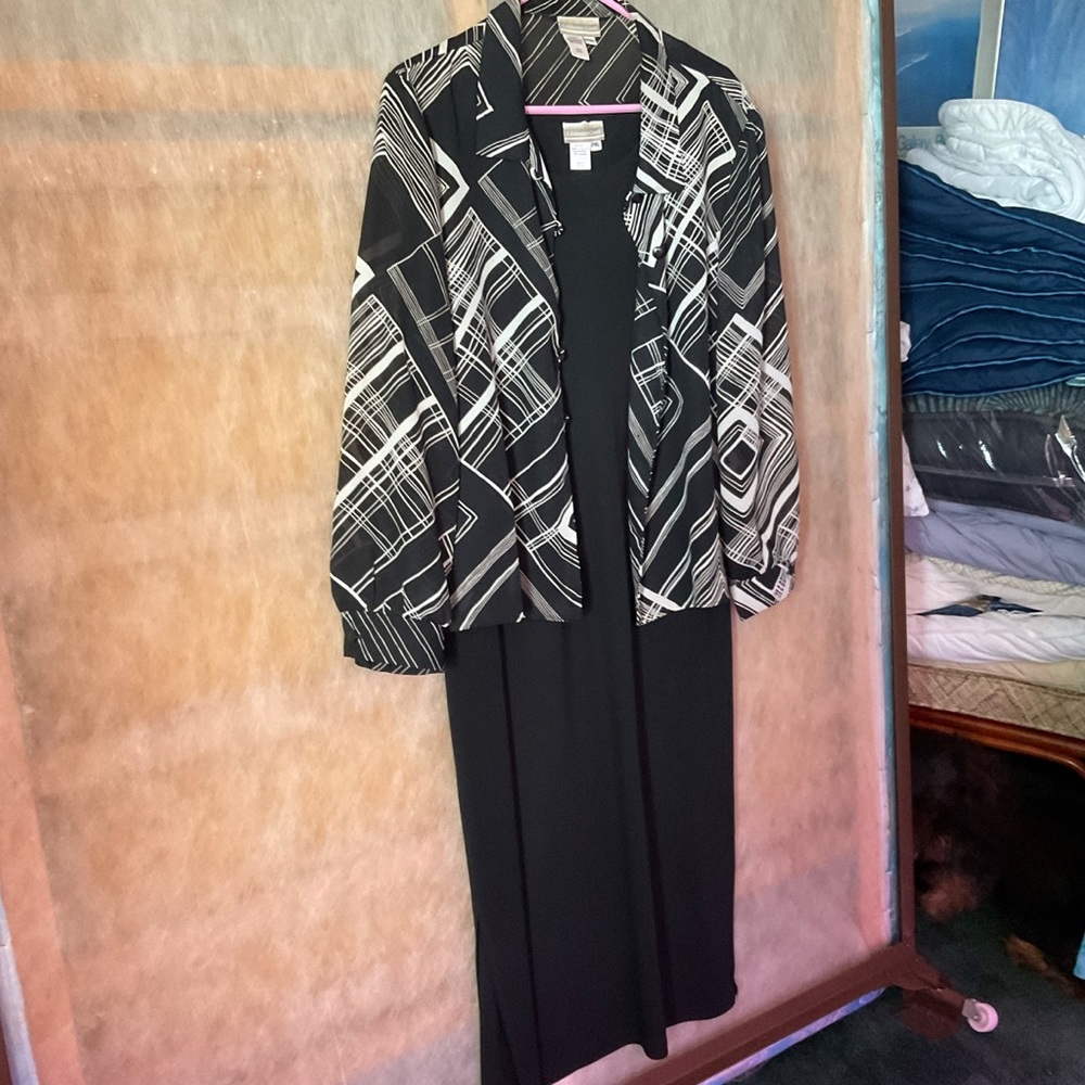Sleeveless dress with jacket. In excellent condition.